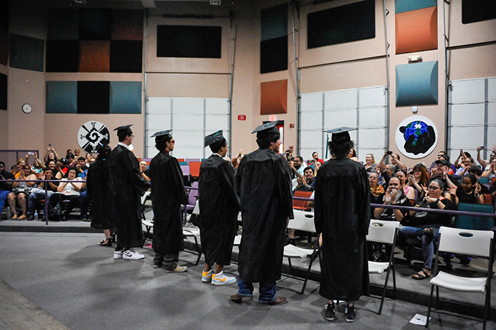 Graduates turn to face the audience