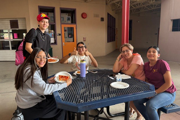 Families enjoy their pizza